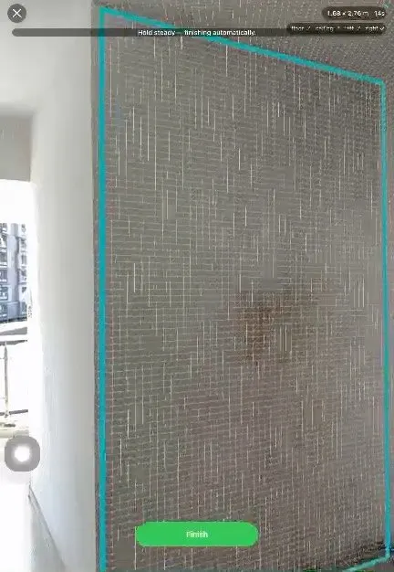 DeltaTapeless on an iPhone, measuring a tiled wall with its edges outlined